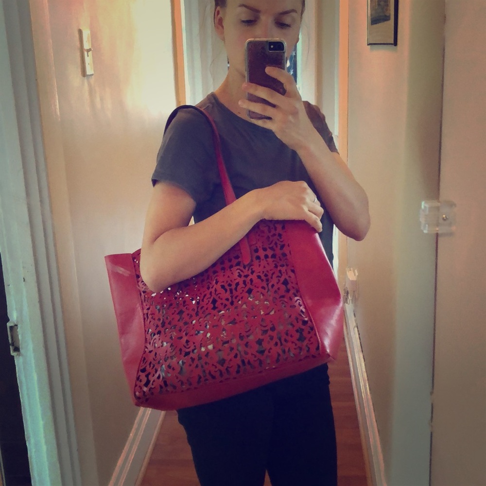 Laser-cutout red tote bag